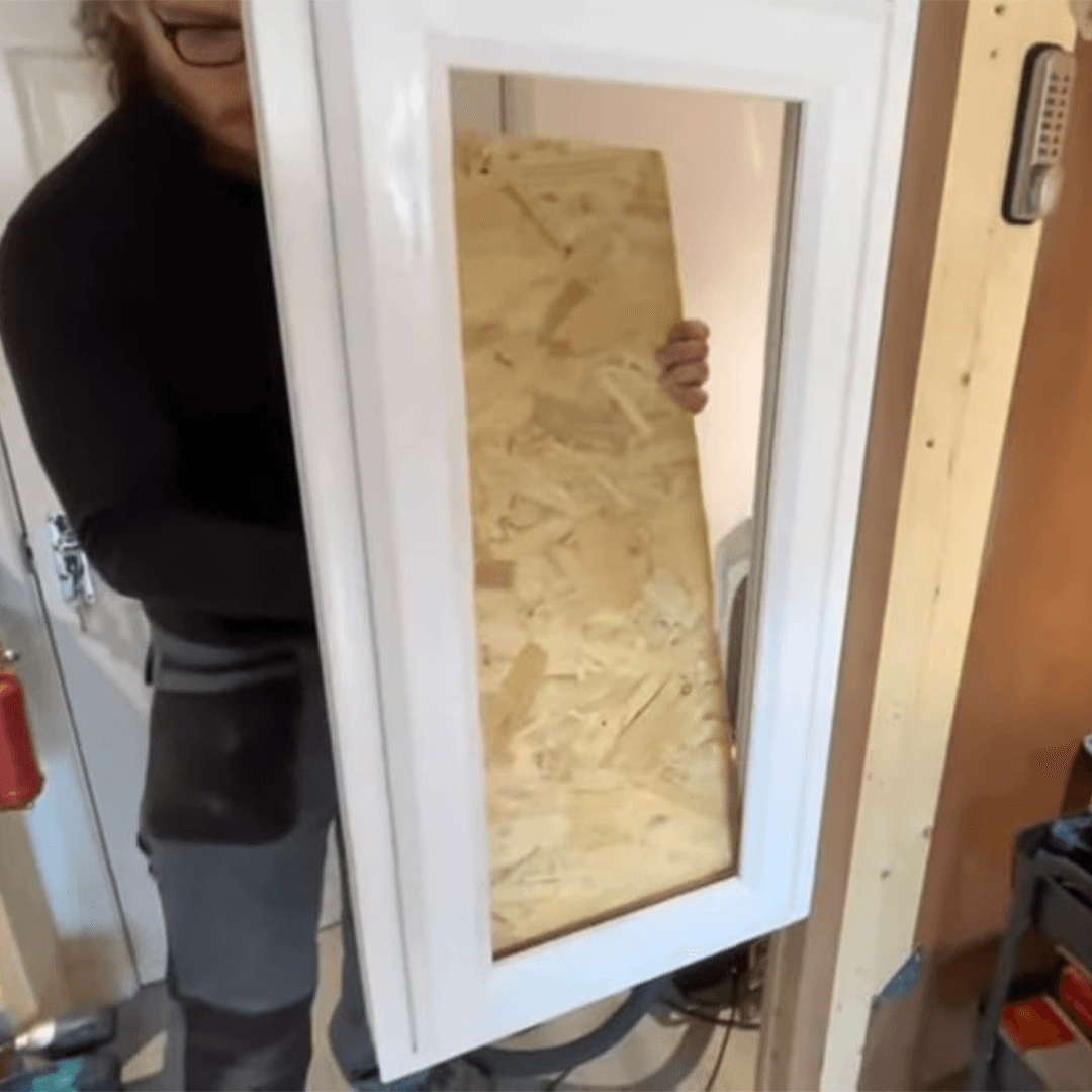 Ad Locksmith boarding up a window replacement