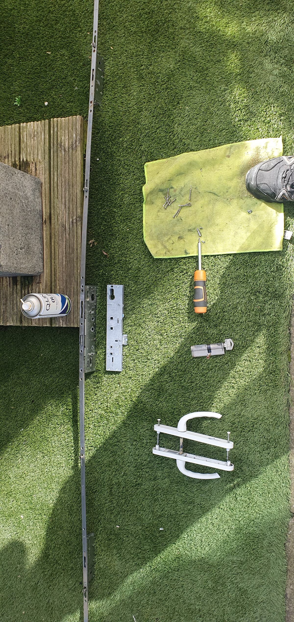 Part of a new locking mechanism on a door repair