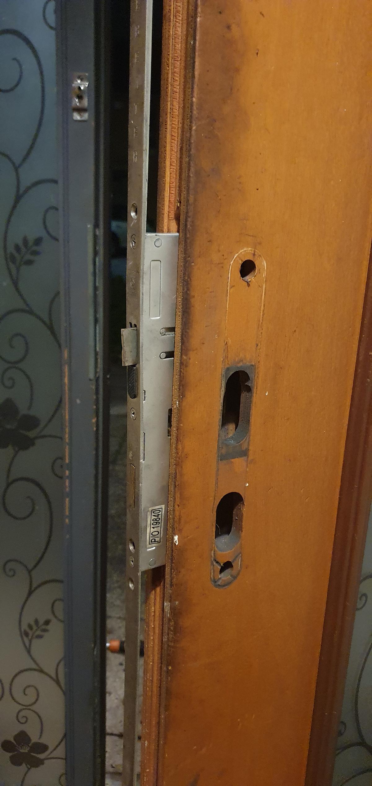 A broken door lock that will be fixed by AD Locksmithing
