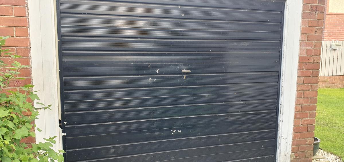 Locksmith tools and a garage door in Gateshead